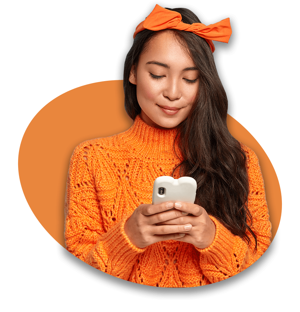 young-woman-orange-sweater-chatting-her-smartphone-min.png